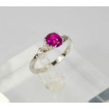 An 18ct white gold and pink sapphire ring, the sapphire approx 1ct, with diamonds totalling 0.20ct.