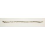 An 18ct white gold tennis bracelet, the brilliant cut diamonds totalling 5.19ct, 13.8g.