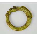 A Chinese green jade handcarved dragon bangle. 8cm