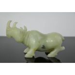 A Chinese handcarved natural heitian green ice jade statue of rhinoceros 12cm length x 7cm high