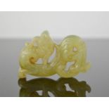 A Chinese natural heitian jade hand carved dragon. 6cm by 4cm