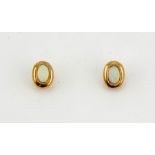 A pair of 9ct gold and opal earrings, the opals each approximately 0.60cts.