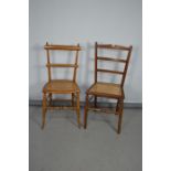 Two chairs with caned seats, together with a rush seat stool, and an occasional table.