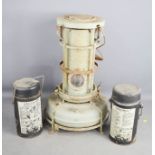 An Alladin paraffin heater, and two Thermos flasks.