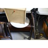 A 1940s wall cabinet, mirror and a piano stool.