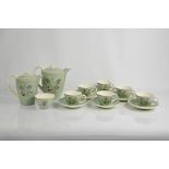 A Poole pottery coffee set, comprising coffee pot, water pot, sugar bowl, and six coffee cups and