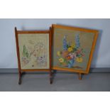 Two vintage fire screens containing needleworks panels.