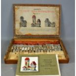 A vintage 'Tudor Stones Building Bricks' game, with original instruction manual and box.