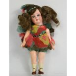 A small Armand Marseille bisque head doll, dressed as a fairy, with hand painted arms and legs, 13cm