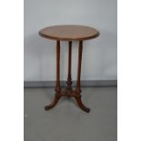 A 19th century mahogany occasional table with circular top, 67cm high.