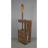 A wooden antique vice / clamp.