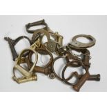 A set of antique handcuffs and keys.