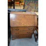 A small oak bureau, with fall front enclosing fitted interior.