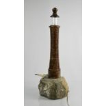 A Cornish serpentine marble table lamp, in the form of a lighthouse, with seagull modelled to the
