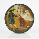 A 19th century snuff box, black lacquered, roundel form, painted with a figural scene, monk