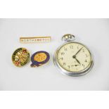 A Smiths pocket watch, together with enamelled badges: Northampton, For Home and Country and