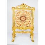 A 19th century giltwood fire screen, with needlework panel, 170 by 73cm