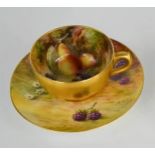 A Royal Worcester coffee can and saucer painted with fruits, signed Phillips, with gilded