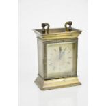A French brass carriage clock, with machine engraved Roman numeral dial, 13cm high.