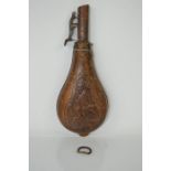 An antique leather powder / shot flask with decoration