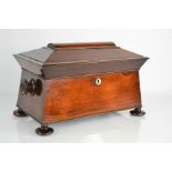 A 19th century mahogany sarcophagus form tea caddy, with bowl and spoon, 23 by 36 by 20cm.