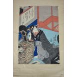 A Japanese woodblock, signed Kunisada, dated 1818, depicting a lady at her dressing table with