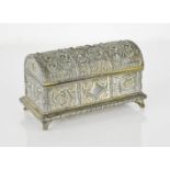 A cast metal casket, lined with faux fur, embossed with decorative panels, raised on knop feet, 7 by