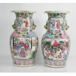 A pair of 19th century Chinese Canton Famille Rose vases. 36cms