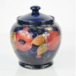 A Moorcroft jar and cover, in the pomegranate pattern, signed in blue William Moorcroft to the base,
