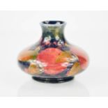 A Moorcroft vase, of squat form, in the pomegranate pattern, bearing impressed Burslem mark to the