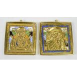 A pair of brass and enamel Russian icons. 5cms x 5.5cms