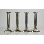 A set of four silver candlesticks, Sheffield 1913, 22cm high.