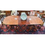 A Regency mahogany pedestal dining table with an extra leaf. 73cms tall x 210cms long (with leaf)