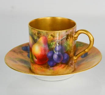 A Royal Worcester coffee can and saucer, hand painted with fruits, signed Hale, with gilded