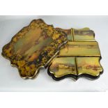 A 19th century papier mache counter box, painted with signed scenes of Lake Como on the lid, and