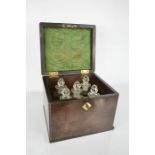 A Georgian mahogany travelling apothecary box / tantalus, containing five original cut glass