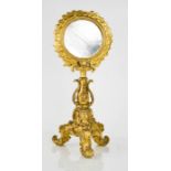 A late 18th / early 19th century Italian giltwood altar centrepiece, the later circular mirror