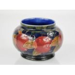A Moorcroft ovoid jar, in the pomegranate pattern, with impressed Cobridge factory mark to the