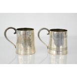 A pair of Sterling silver tankards, with line decoration to the bodies, 10cm high, 19.84toz.