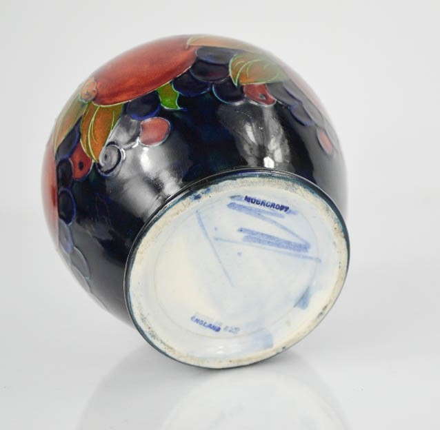 A Moorcroft jar and cover, in the pomegranate pattern, signed in blue William Moorcroft to the base, - Image 2 of 2