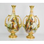 A Royal Worcester pair of vases signed by William Powell, hand painted with peacocks and peahens