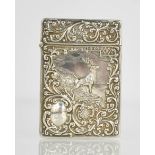A silver card case, embossed with scrollwork and a scene with stag and deer, engraved Nov 15th 1902,