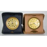 Two 1920s travelling alarm clocks, with arabic dials and subsidiary seconds.