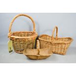 Three vintage wicker baskets.