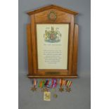 A Framed WWII memoriam scroll and medals to Lance Corporal E. Chapman Royal Lincolnshire regiment