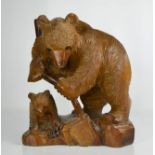 A 20th century carved Bavarian bear and cub. 32cms tall