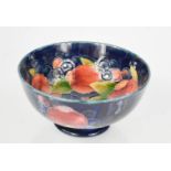 A Moorcroft bowl, in the pomegranate pattern, with blue painted William Moorcroft signature to the