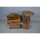 A group of treen to include a letter rack, stand, box carved with Taj Mahal and a trinket box