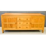 Don Craven ‘The Foxman’ oak dresser, with fielded panel cupboard doors flanking drawers, one with