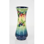 A Moorcroft vase in the grape and leaf pattern, with impressed facsimile signature and Potter to